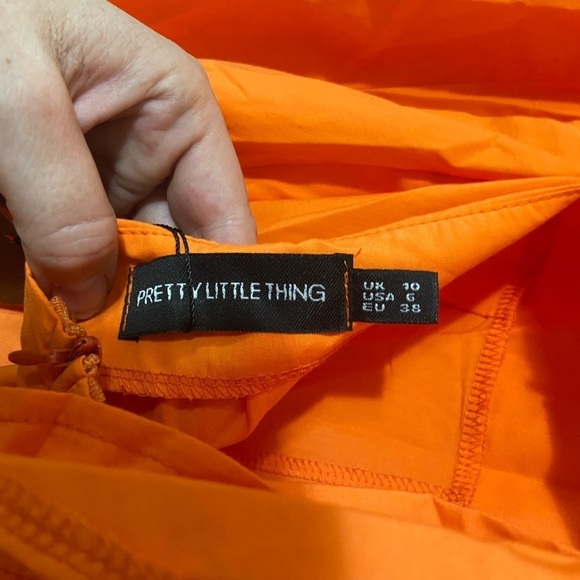 Pretty Little Things size 6 bright orange tie back long sleeve playsuit NWT - Picture 7 of 7